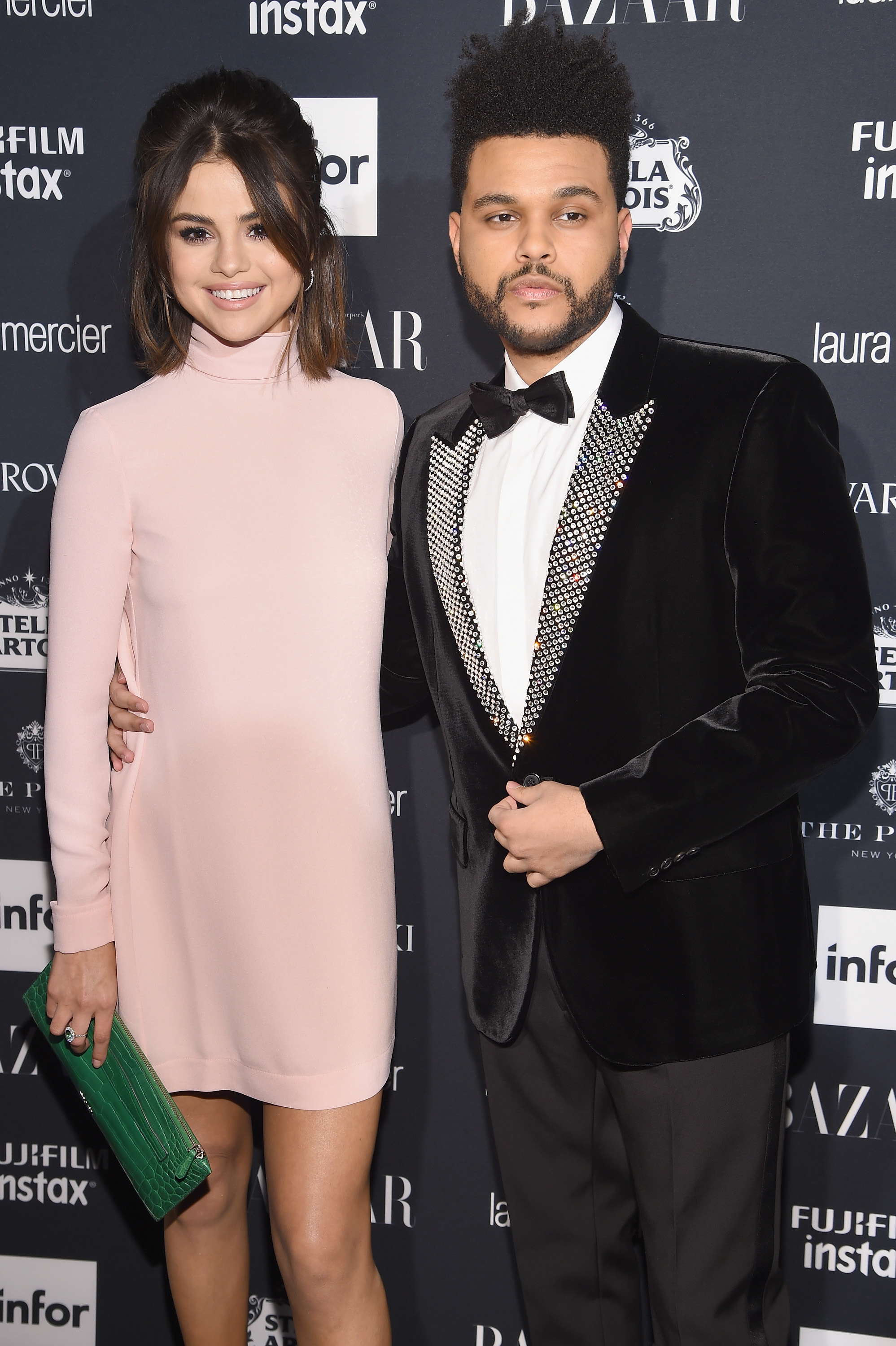 Selena Gomez Embraces The Weeknd During Their Red Carpet Debut at