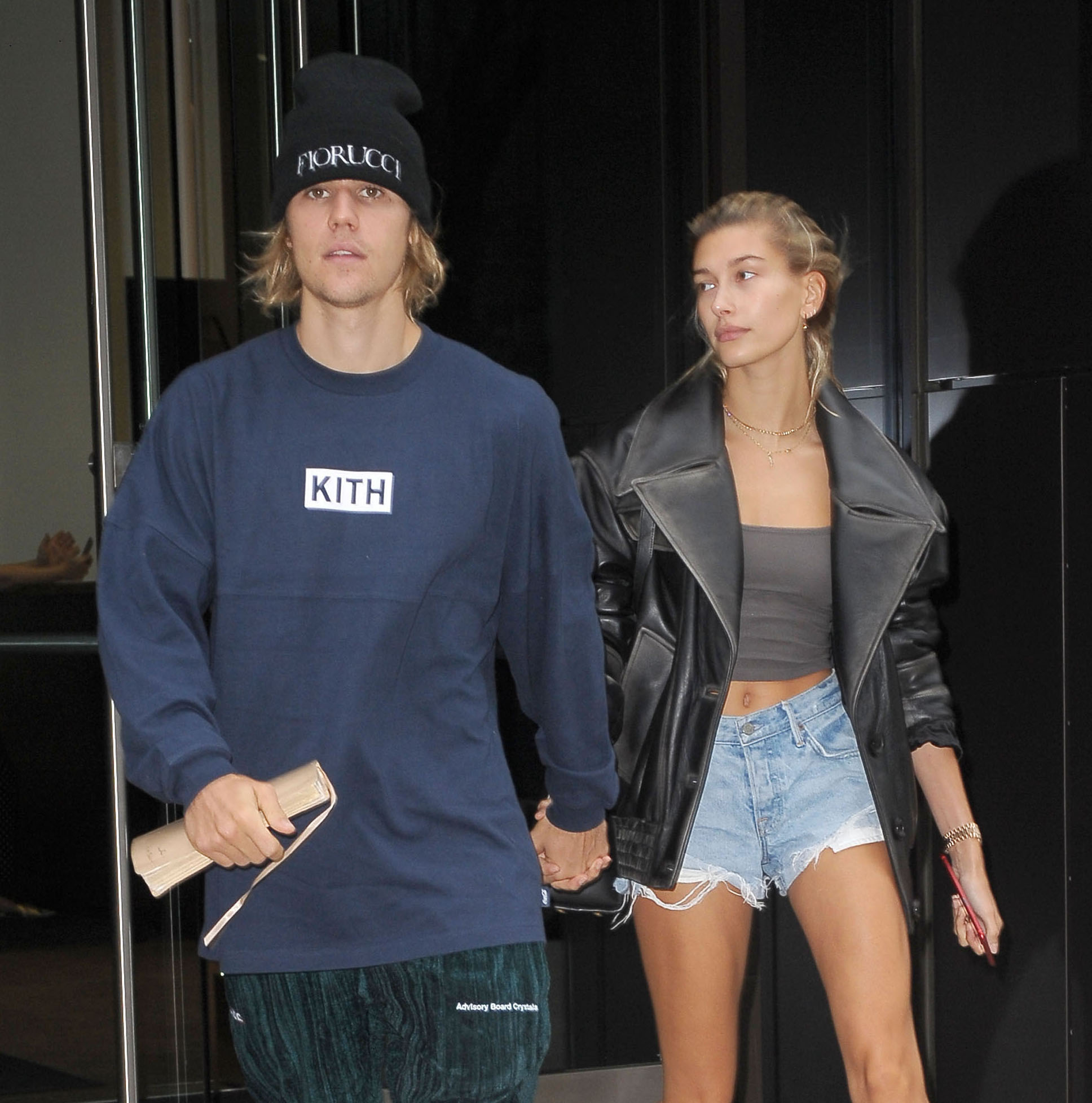 Hailey Bieber reveals her taut midriff while modeling a lavender